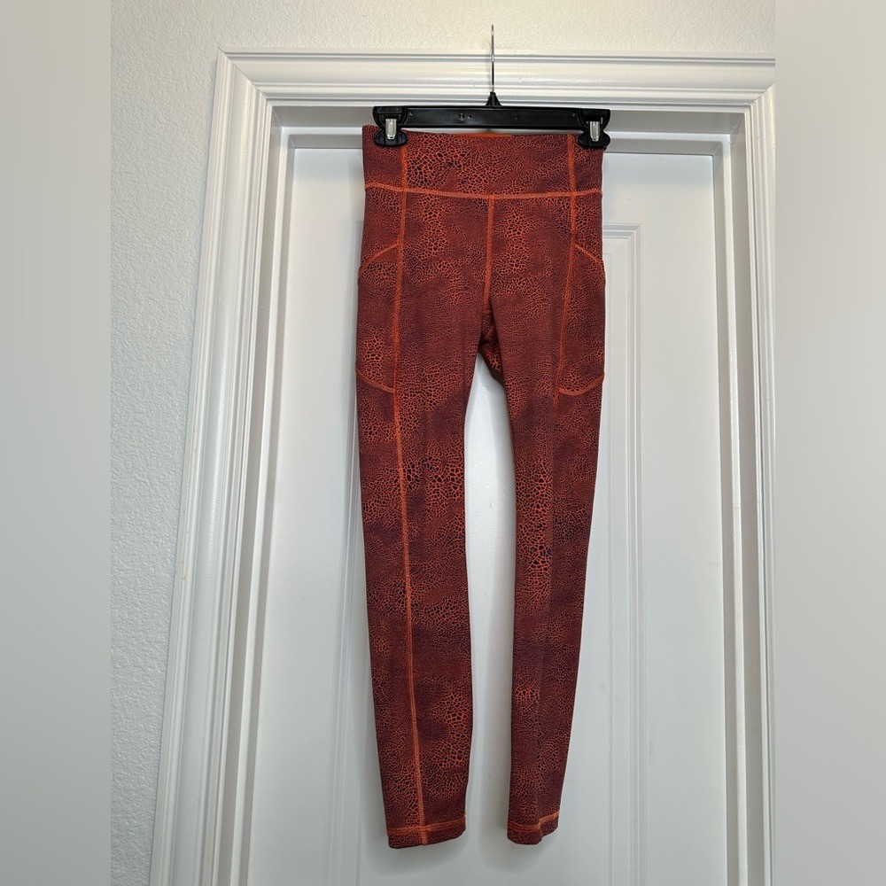 Lululemon Invigorate High-Rise leggings in orange crackle glaze color‎ Size 4